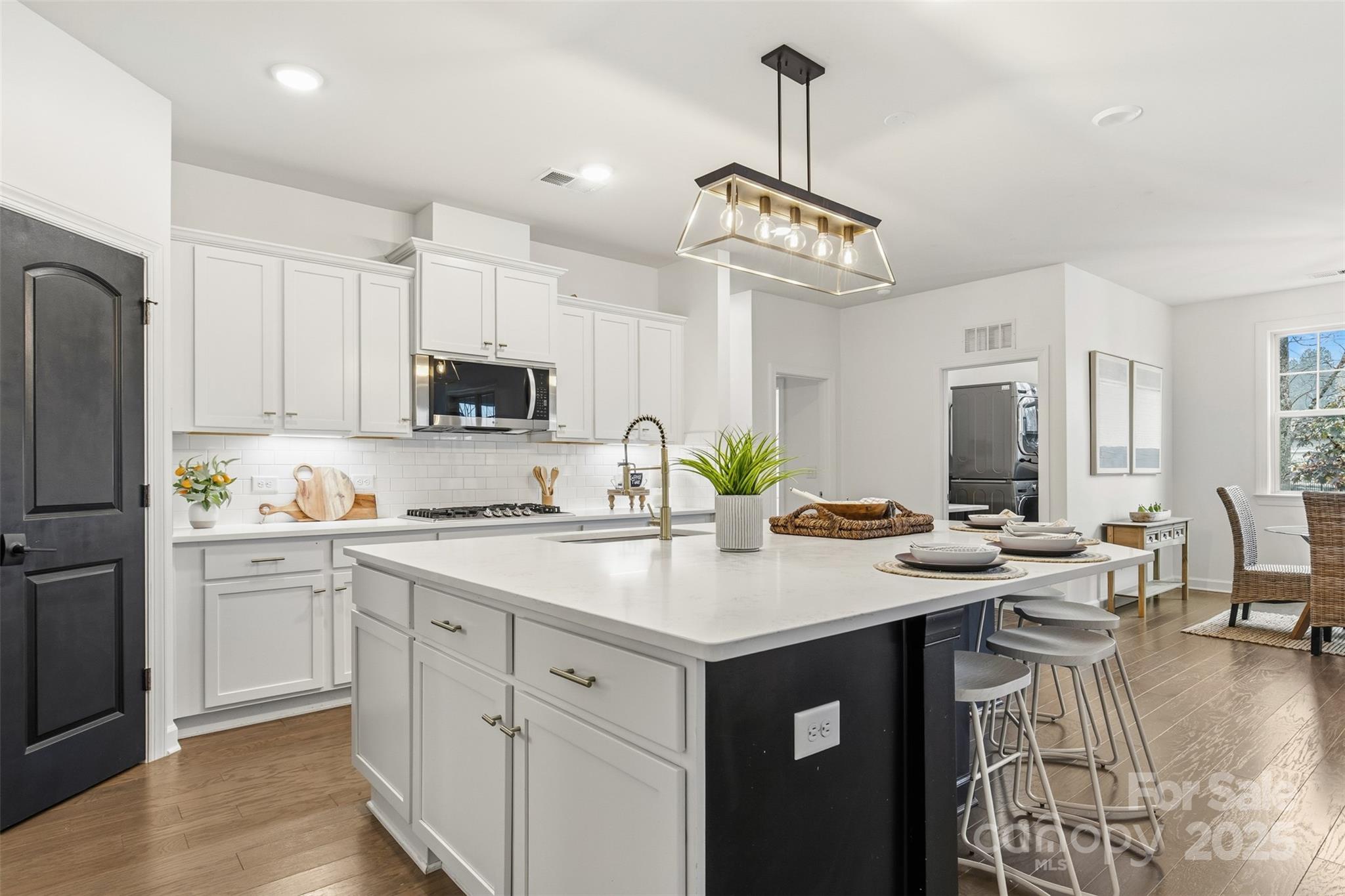 16714 Setter Point Lane Davidson, NC 28036 - Photo 12 of 29 a kitchen with a center island a counter space cabinets and appliances