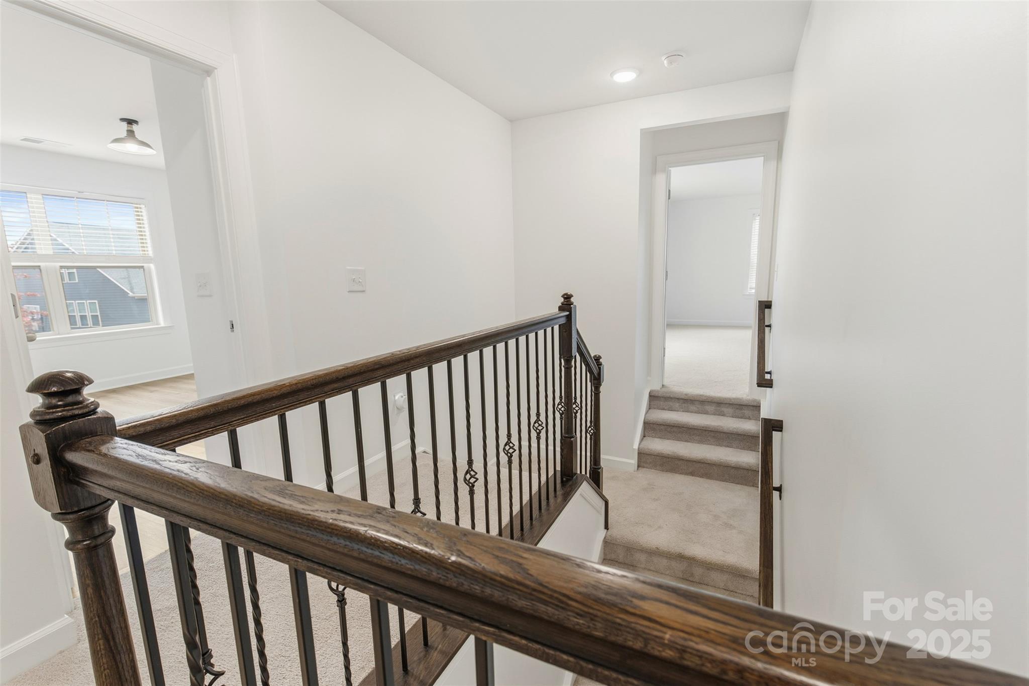 16714 Setter Point Lane Davidson, NC 28036 - Photo 16 of 29 a view of staircase with wooden floor and stairs