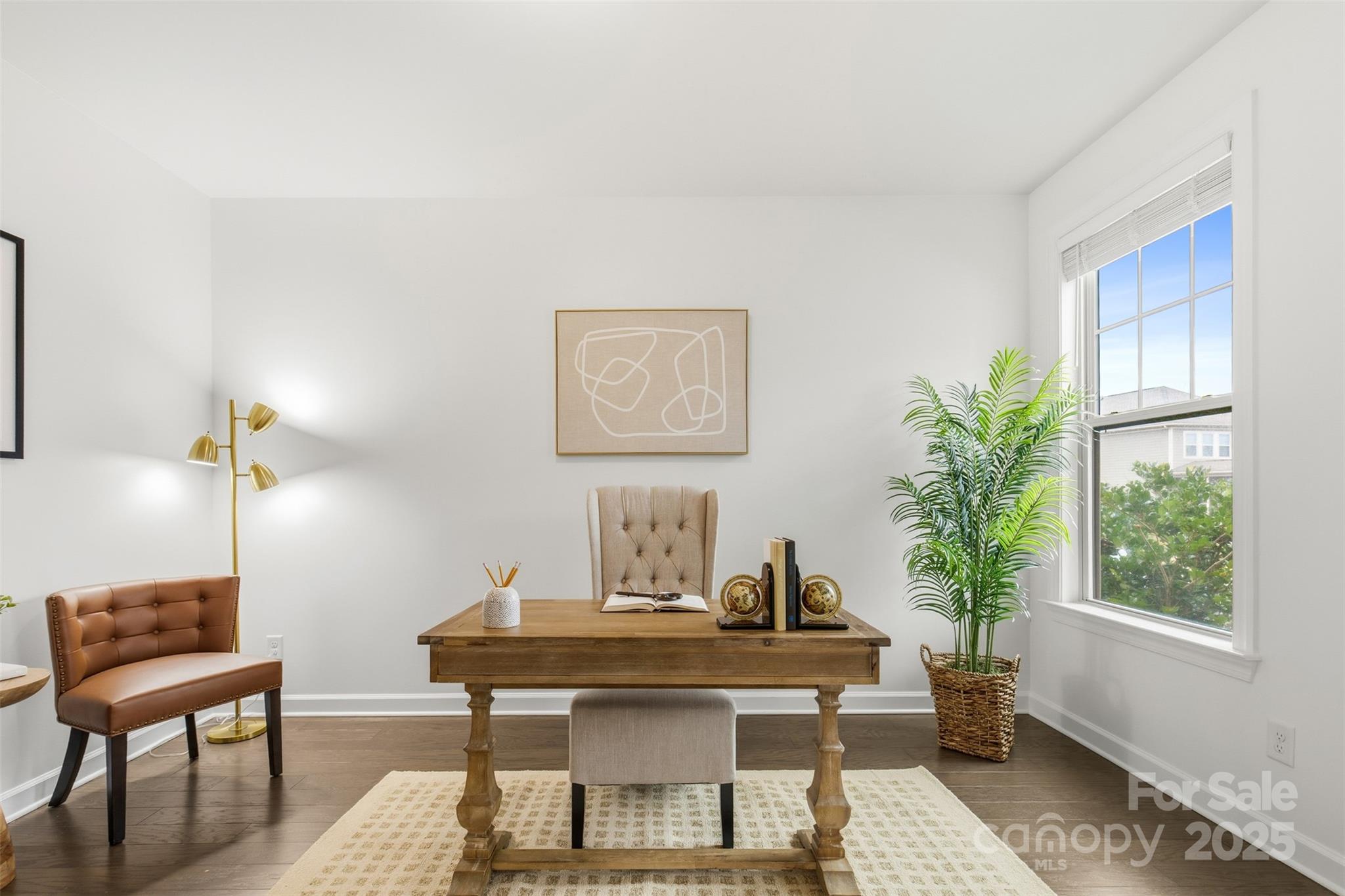 16714 Setter Point Lane Davidson, NC 28036 - Photo 5 of 29 a view of a workspace with furniture and a potted plant