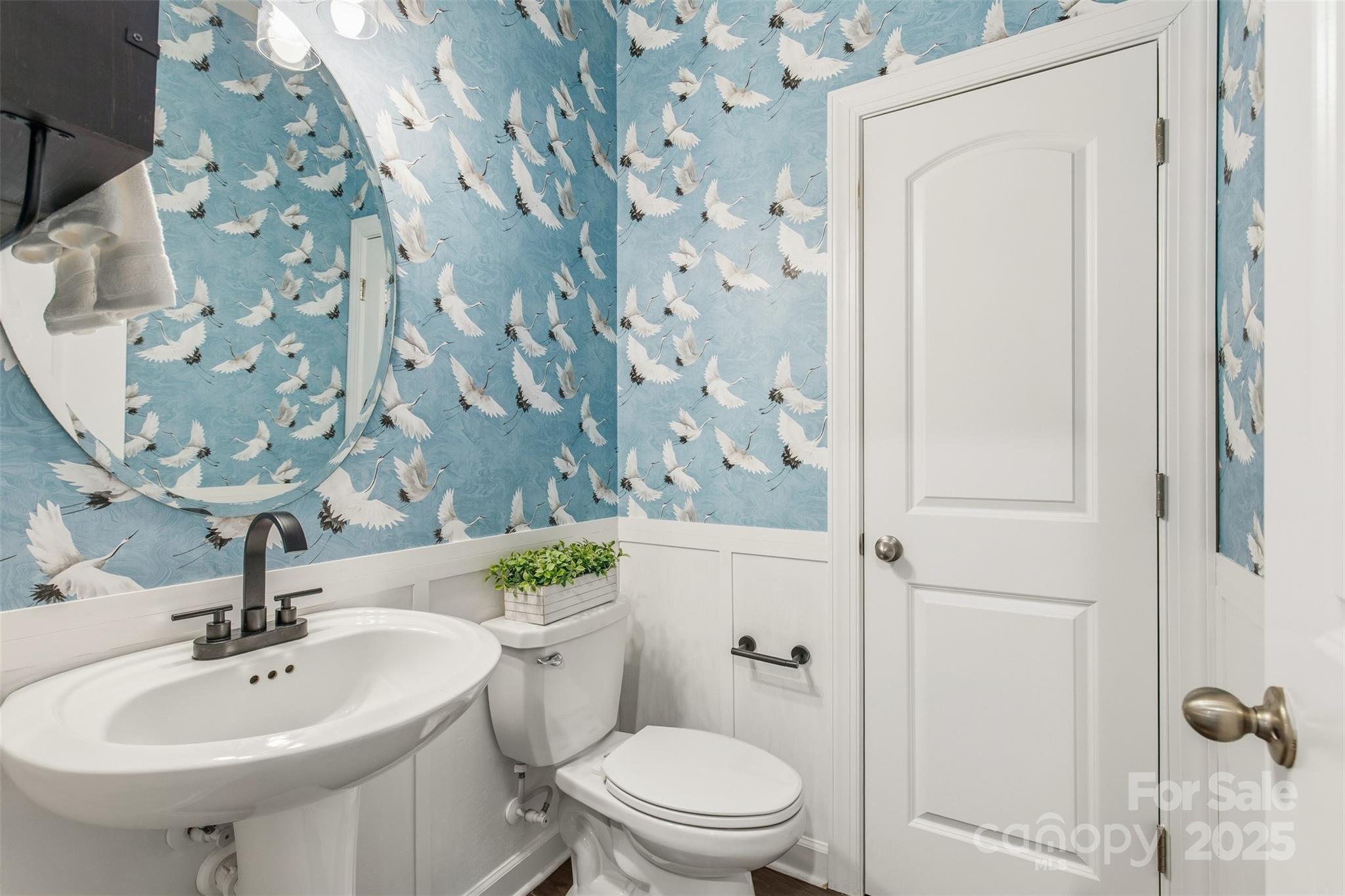 16714 Setter Point Lane Davidson, NC 28036 - Photo 7 of 29 a bathroom with a sink a toilet and shower curtain