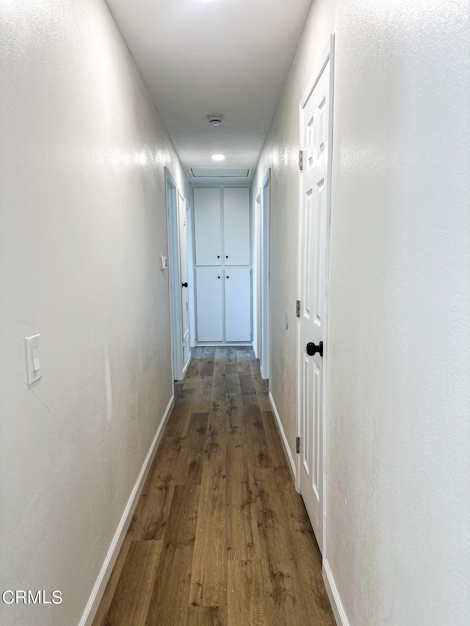 1805 MacArthur Place Oxnard, CA 93033 - Photo 12 of 23 a view of a hallway with wooden floor