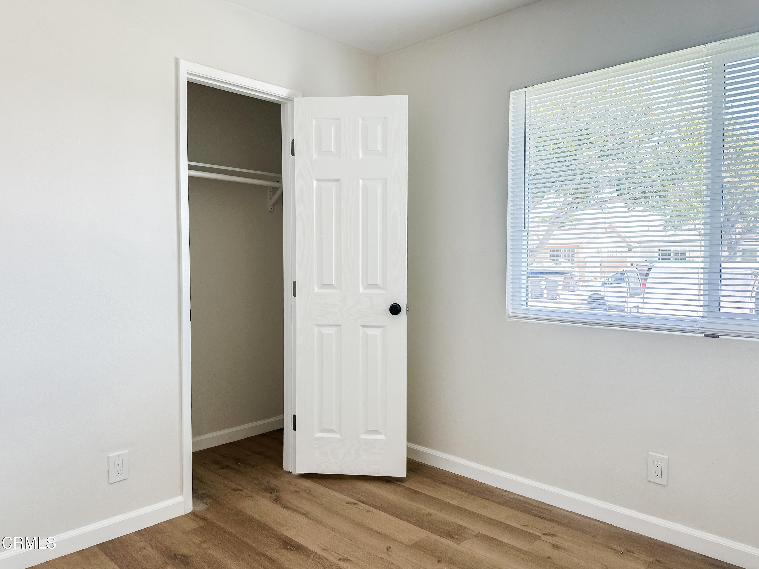 1805 MacArthur Place Oxnard, CA 93033 - Photo 13 of 23 an empty room with wooden floor and windows
