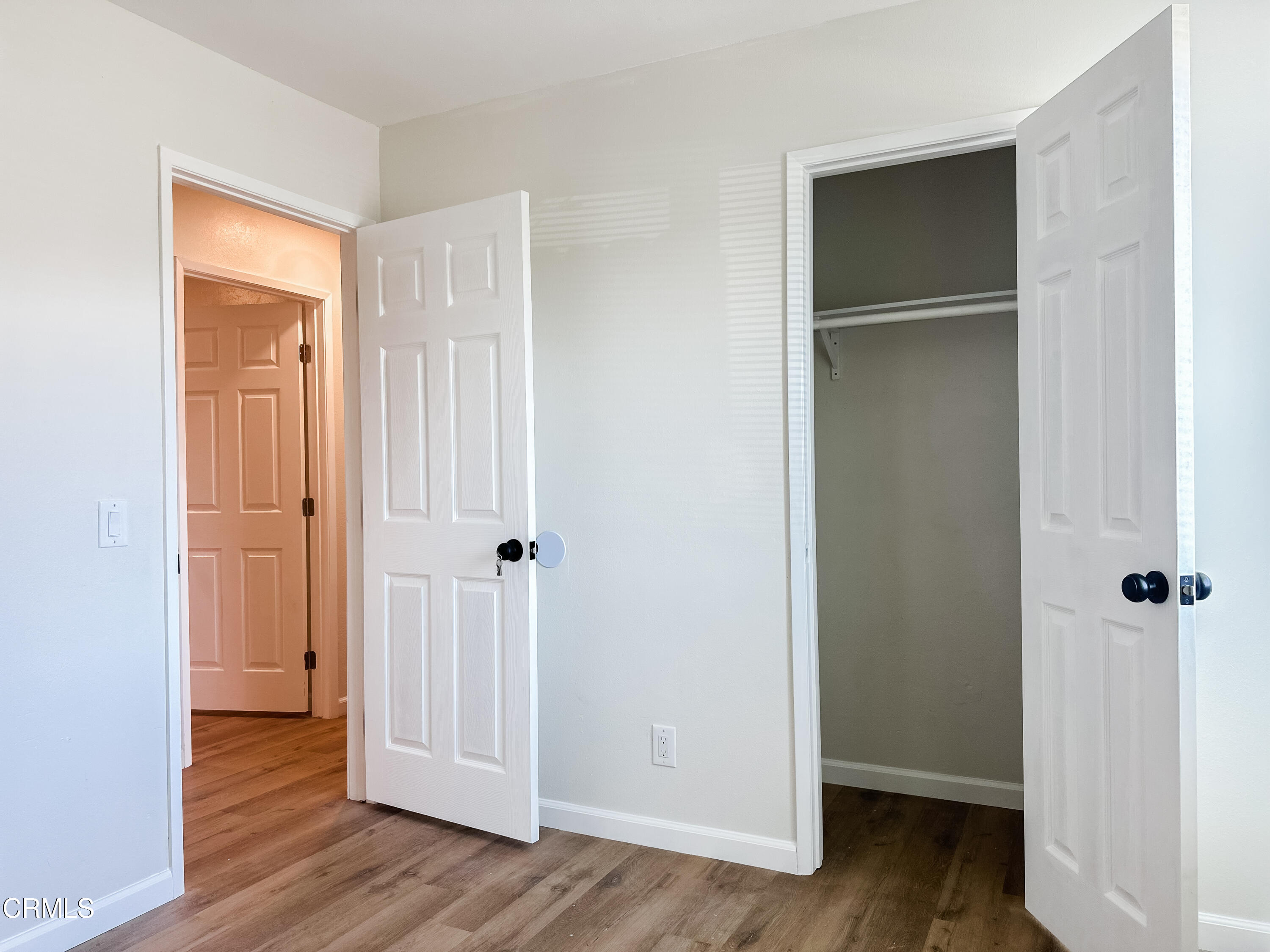 1805 MacArthur Place Oxnard, CA 93033 - Photo 14 of 23 an empty room with wooden floor & closet area