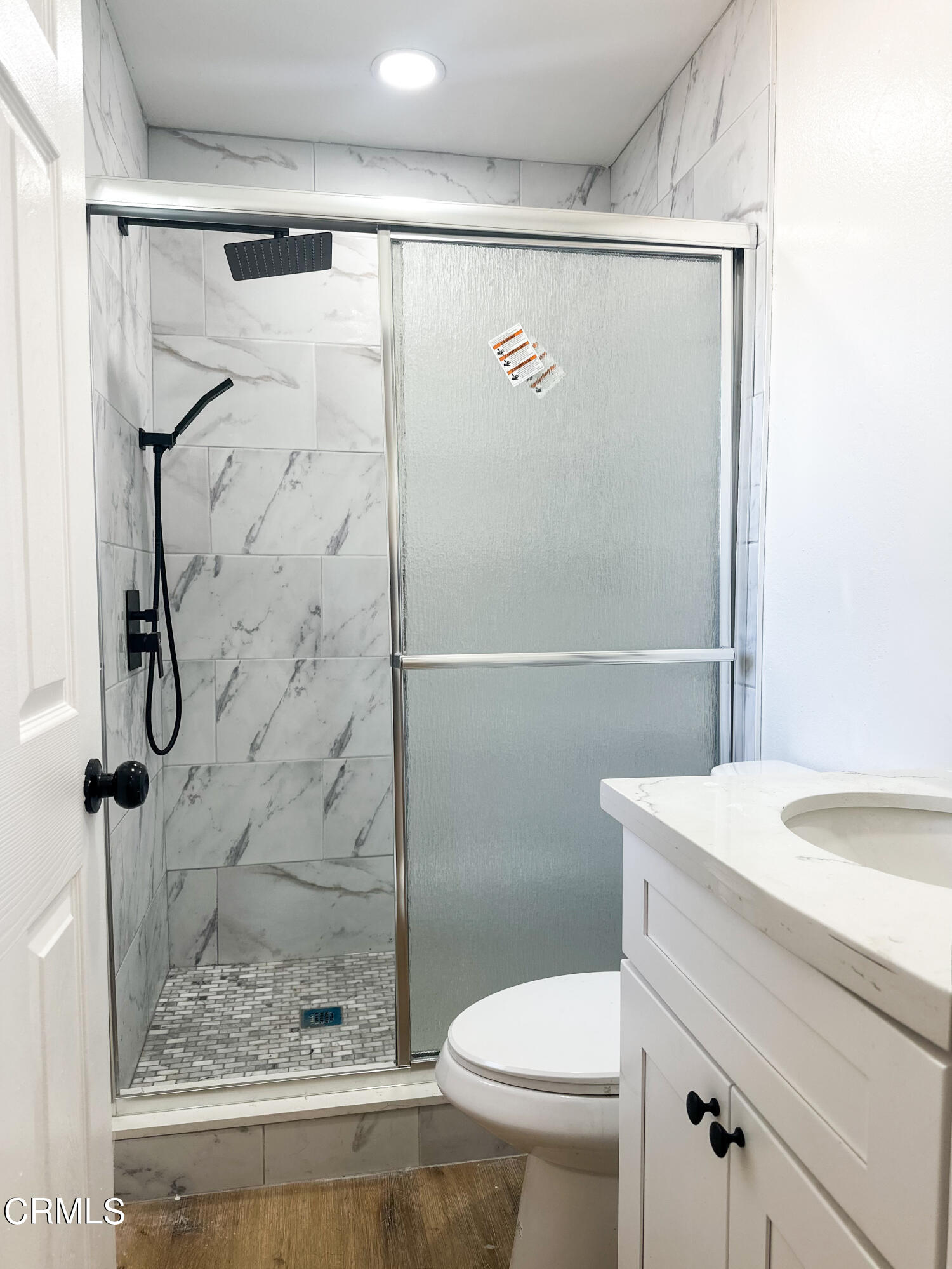 1805 MacArthur Place Oxnard, CA 93033 - Photo 16 of 23 a bathroom with a shower a toilet and sink