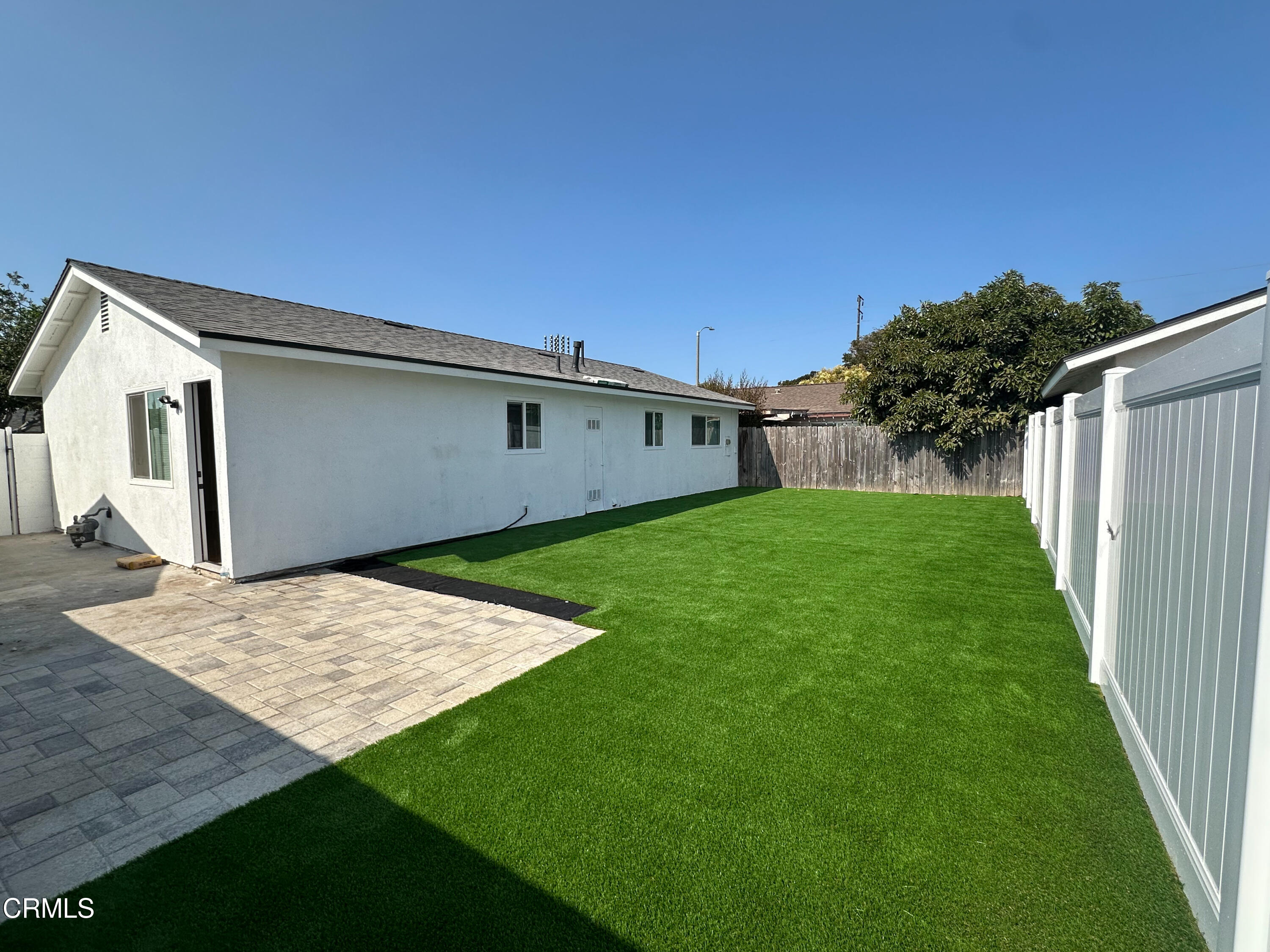 1805 MacArthur Place Oxnard, CA 93033 - Photo 19 of 23 a backyard of a house with table and chairs