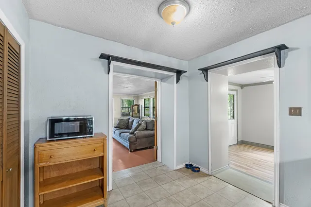 a view of a livingroom with furniture and a flat screen tv