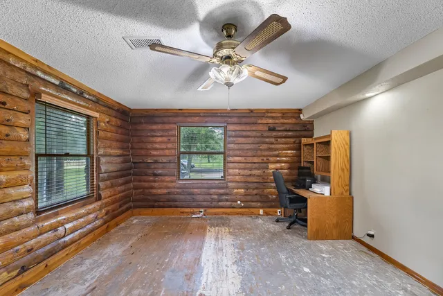 a view of a livingroom with furniture and front door
