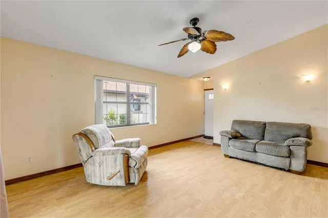 a living room with furniture and a window