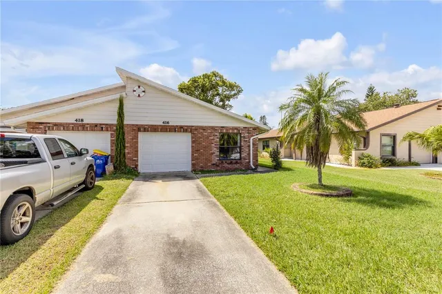 a house with swimming pool in front of it