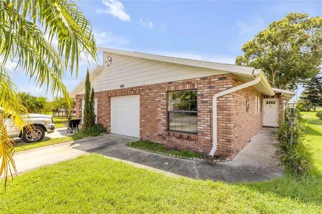 a front view of a house with yard