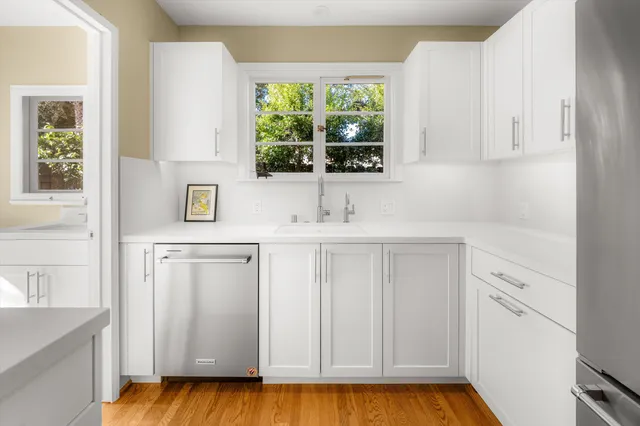 a bathroom with a sink and a window