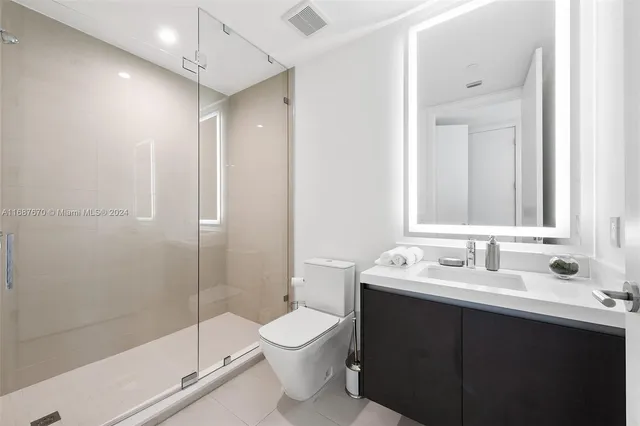 a view of a swimming pool with furniture