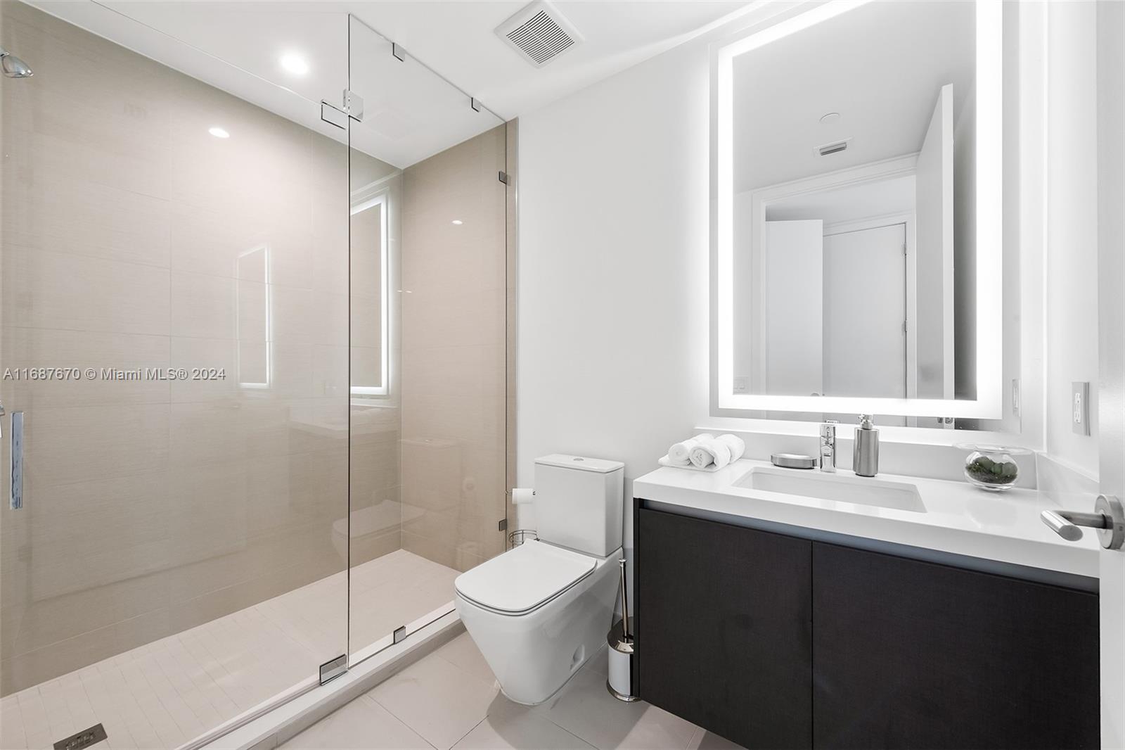 851 Northeast 1st Avenue, Unit PH5112 Miami, FL 33132 - Photo 36 of 77 a bathroom with a sink toilet and shower