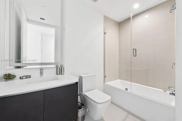 a view of a room with lots of wooden furniture