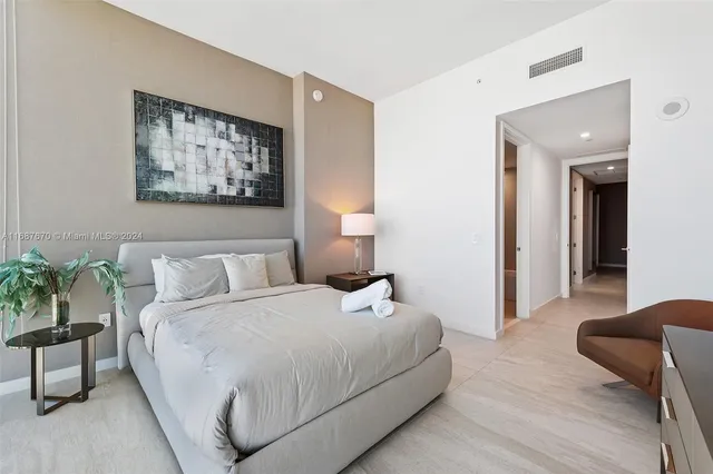 a large kitchen with a table and chairs