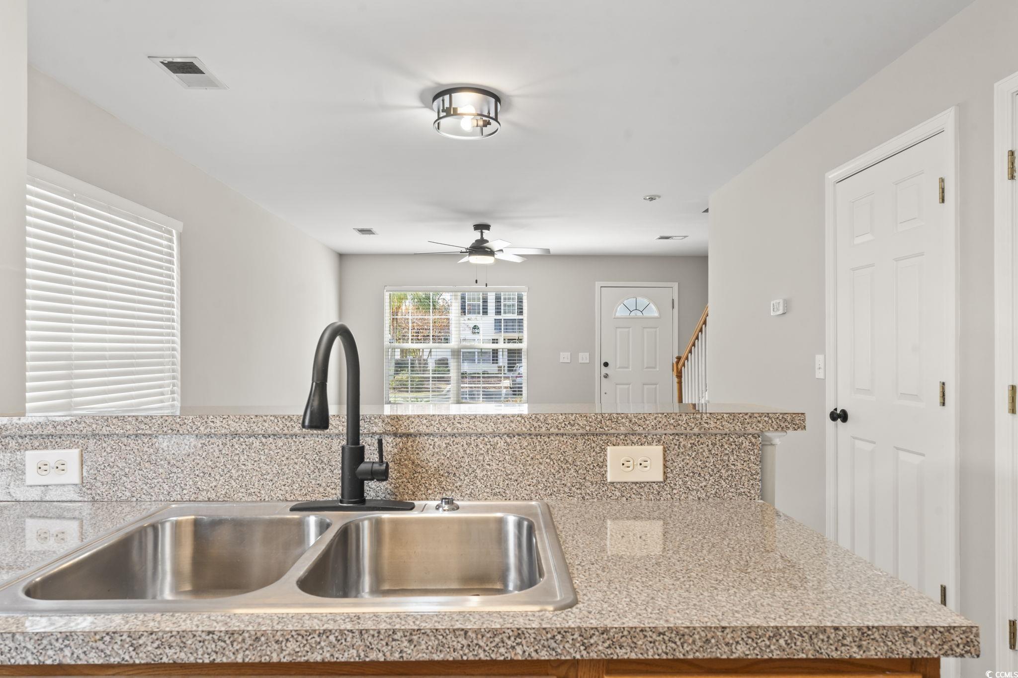 103 Barnacle Lane, Unit R5 Little River, SC 29566 - Photo 11 of 33 Kitchen featuring light countertops and a ceiling fan