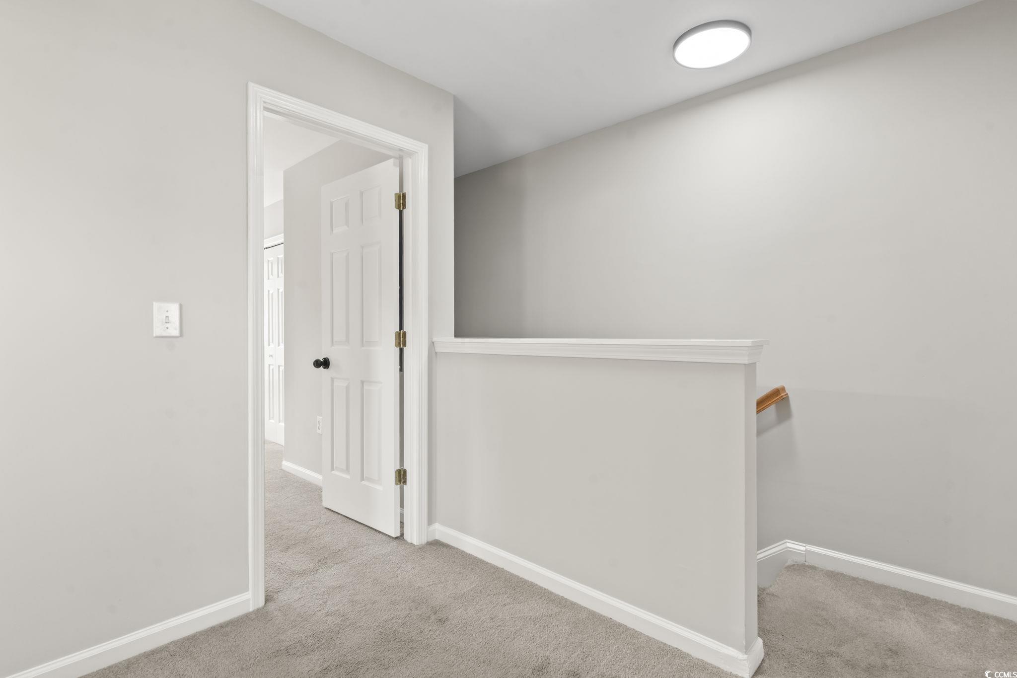 103 Barnacle Lane, Unit R5 Little River, SC 29566 - Photo 20 of 33 Corridor featuring light carpet and an upstairs landing