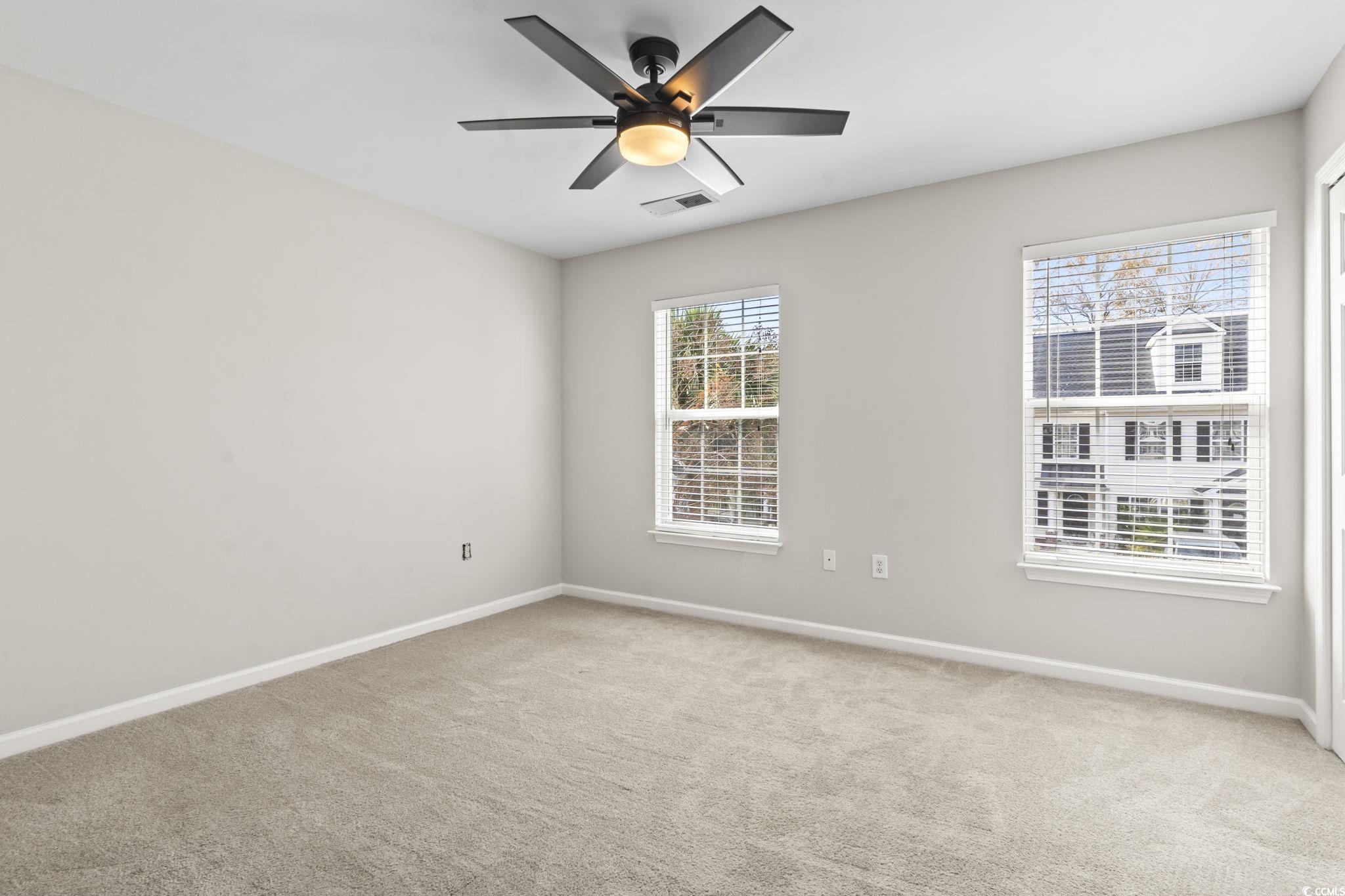 103 Barnacle Lane, Unit R5 Little River, SC 29566 - Photo 22 of 33 Unfurnished room featuring light carpet and ceiling fan