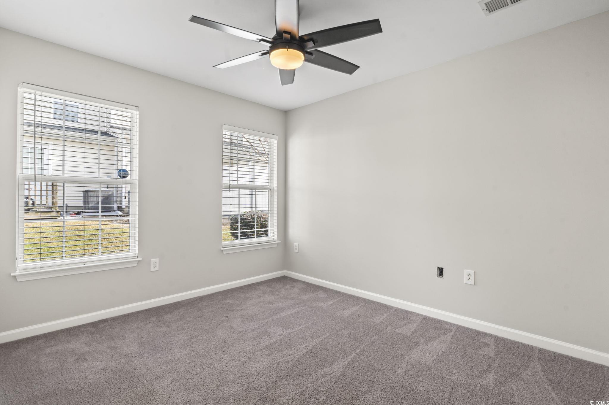 103 Barnacle Lane, Unit R5 Little River, SC 29566 - Photo 25 of 33 Carpeted spare room with baseboards and ceiling fan