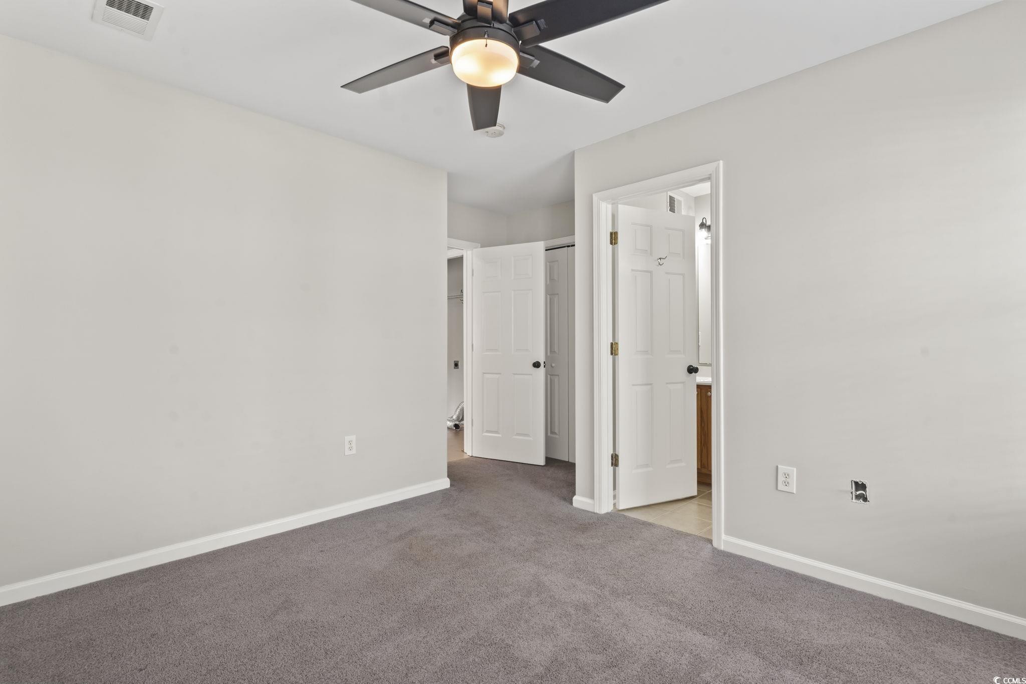 103 Barnacle Lane, Unit R5 Little River, SC 29566 - Photo 26 of 33 Unfurnished bedroom with carpet floors and ceiling fan