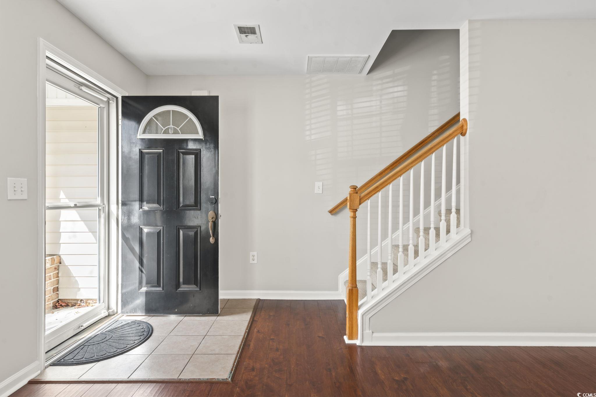 103 Barnacle Lane, Unit R5 Little River, SC 29566 - Photo 5 of 33 Foyer entrance featuring wood finished floors and stairs