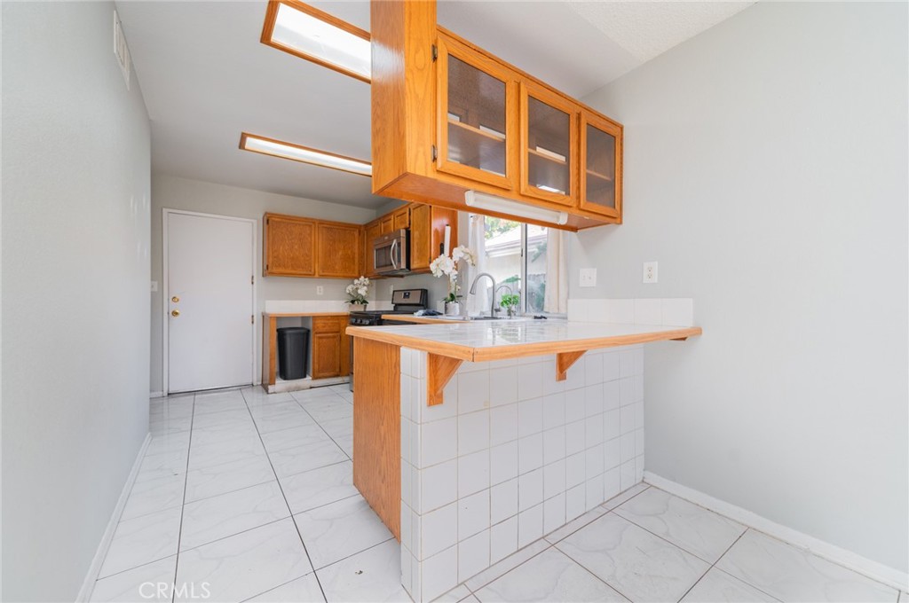 1955 Sierra Espadan Road Perris, CA 92571 - Photo 12 of 29 a view of kitchen with washer and dryer