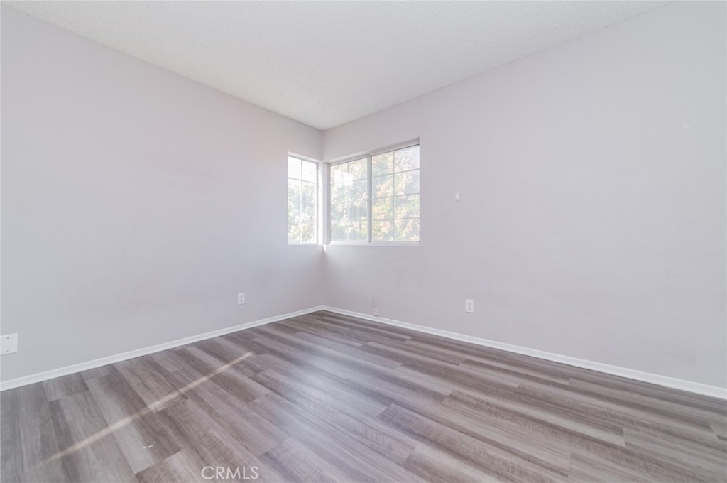 1955 Sierra Espadan Road Perris, CA 92571 - Photo 17 of 29 wooden floor in an empty room with a window