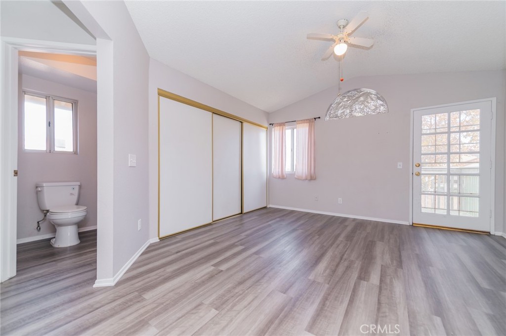 1955 Sierra Espadan Road Perris, CA 92571 - Photo 20 of 29 wooden floor in an empty room with a window