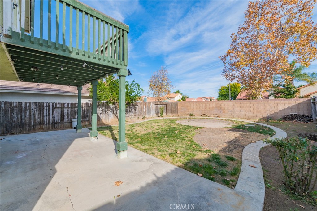 1955 Sierra Espadan Road Perris, CA 92571 - Photo 26 of 29 a backyard of a house with lots of green space