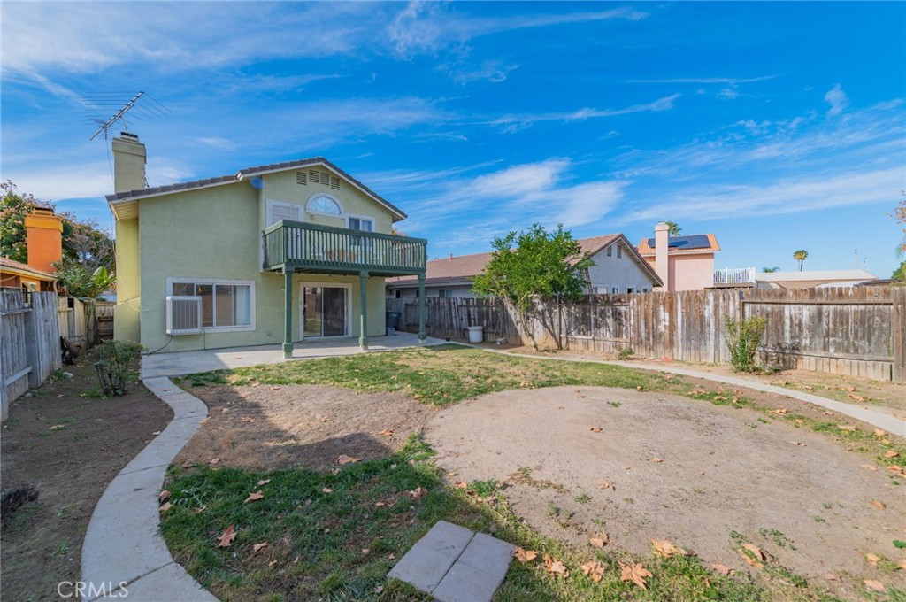 1955 Sierra Espadan Road Perris, CA 92571 - Photo 27 of 29 a front view of a house with garden