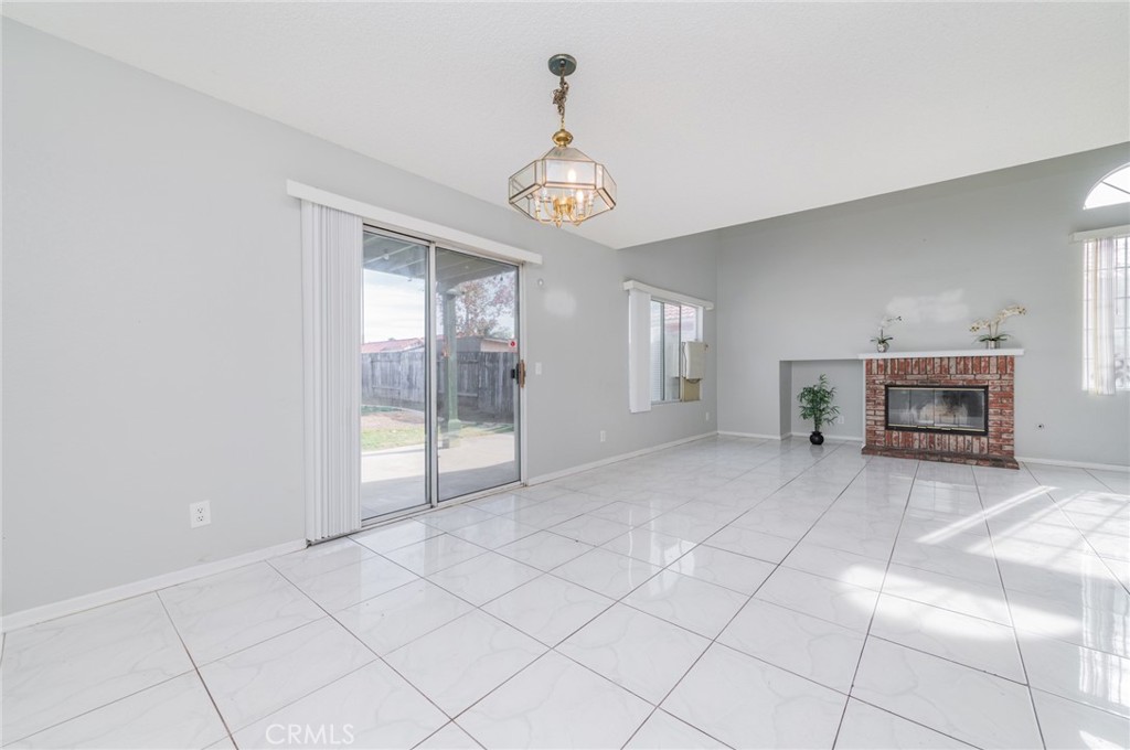 1955 Sierra Espadan Road Perris, CA 92571 - Photo 7 of 29 a view of livingroom with furniture wooden floor and window