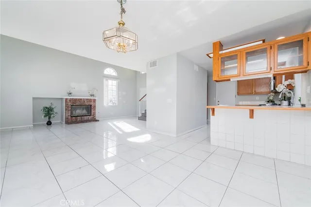 a view of kitchen with furniture and a chandelier
