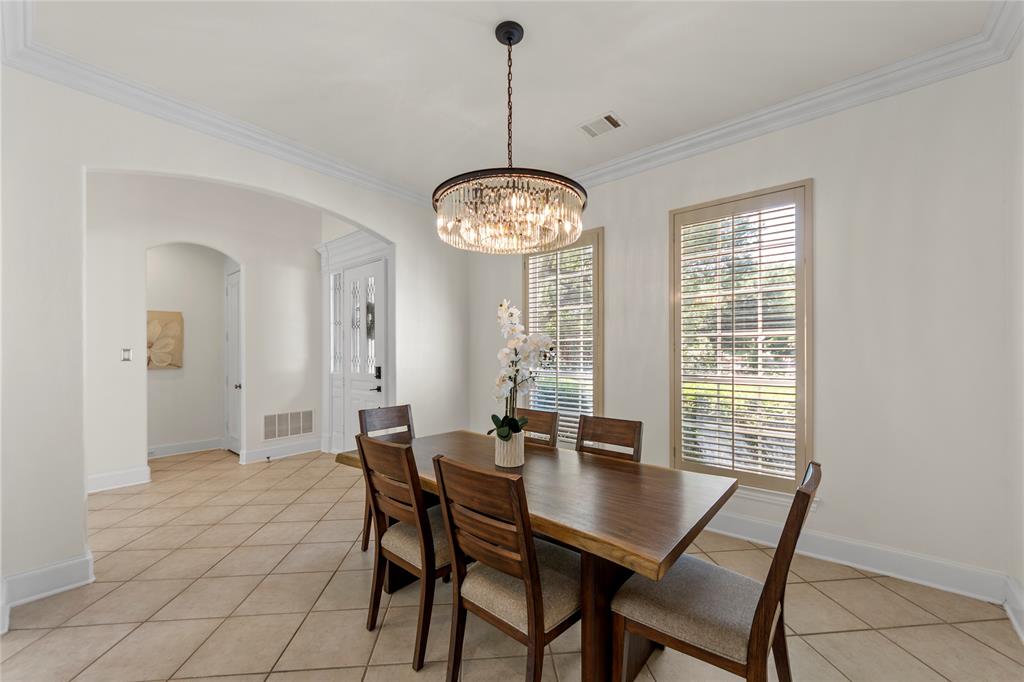 4315 Northaven Road Dallas, TX 75229 - Photo 4 of 40 The formal living and dining areas are filled with natural light and showcase soaring ceilings, oversized windows, and an open, airy feel. Fresh updated paint, elegant new light fixtures, and clean modern finishes create a bright and welcoming atmosphere perfect for both everyday living and entertaining. The spacious formal dining room offers a refined setting for gatherings, while the formal living area overlooks the beautifully landscaped backyard, bringing in peaceful garden views and abundant sunlight.