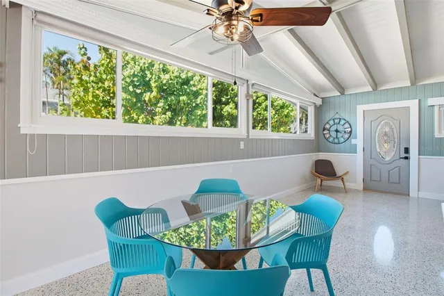 a kitchen with stainless steel appliances granite countertop a refrigerator sink and stove