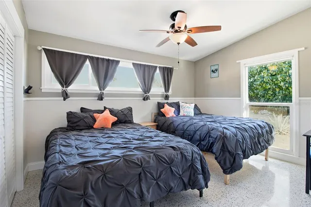 a view of a dining room with furniture wooden floor and windows