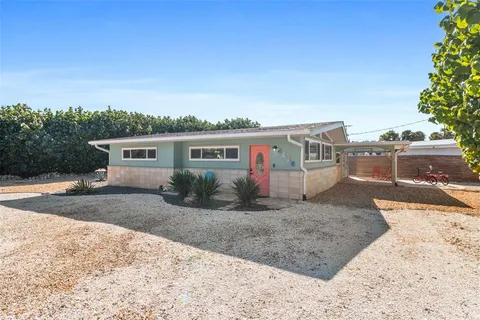 a house view with a backyard space