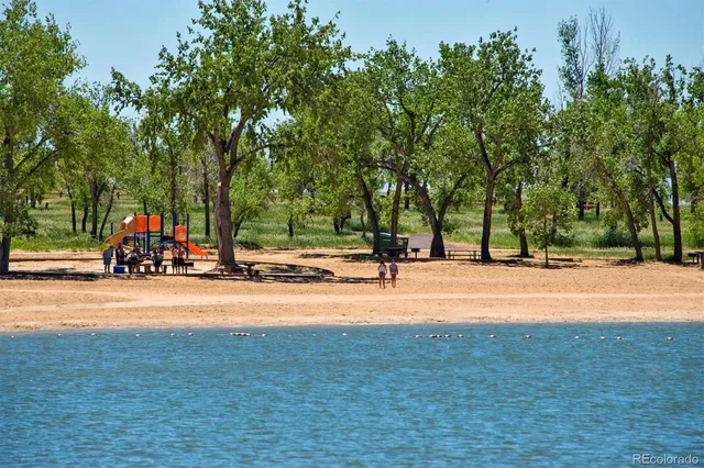 a view of a street with houses on both side of the street