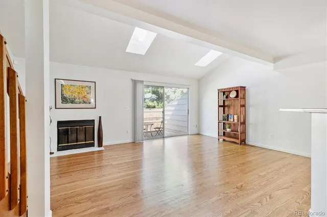 wooden floor fireplace and windows in a room