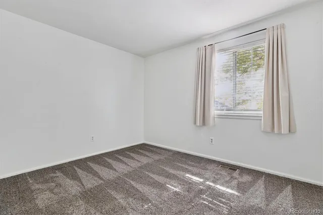 a view of a room that has a window in it