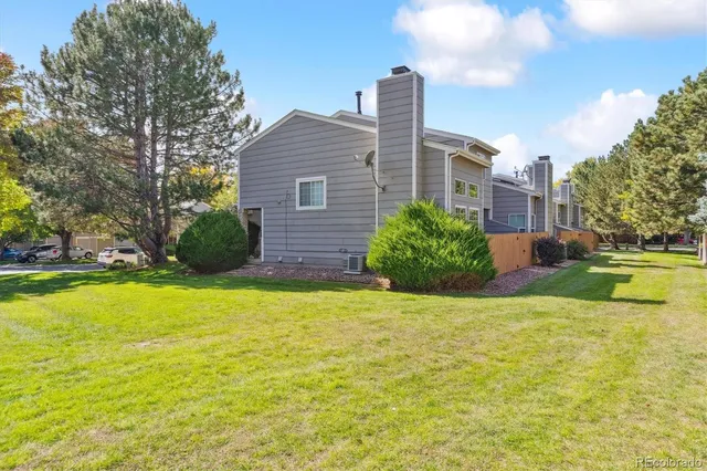 a house view with swimming pool and garden space