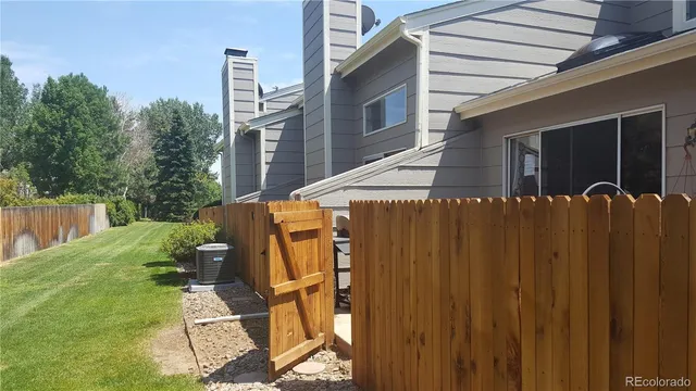 a view of a backyard with sitting area