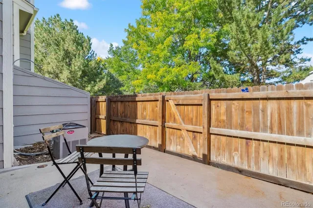 a view of a chairs and table in the balcony