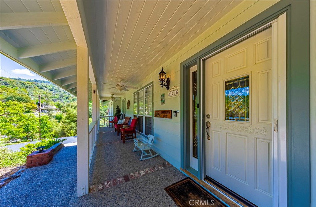 a view of a porch with wooden floor