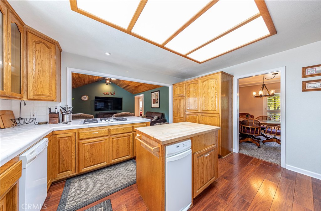 41715 River Falls Road Oakhurst, CA 93644 - Photo 26 of 65 a kitchen with a stove a sink and a refrigerator