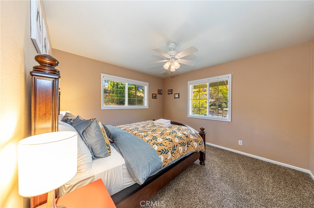 41715 River Falls Road Oakhurst, CA 93644 - Photo 42 of 65 a bedroom with a bed and a window