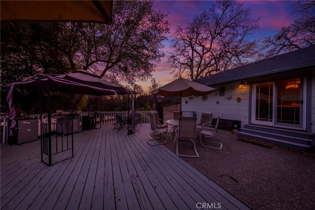 41715 River Falls Road Oakhurst, CA 93644 - Photo 59 of 65 a view of house with deck and outdoor seating