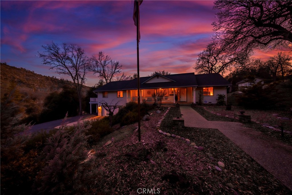 41715 River Falls Road Oakhurst, CA 93644 - Photo 62 of 65 a backyard of a house with table and chairs