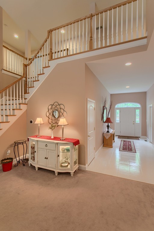 264 Westford Road Tyngsborough, MA 01879 - Photo 11 of 27 a bedroom with furniture and a chandelier