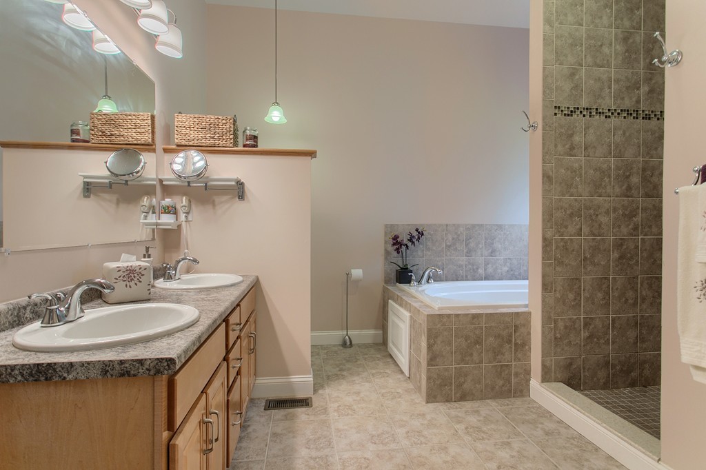 264 Westford Road Tyngsborough, MA 01879 - Photo 16 of 27 a bathroom with a sink a toilet and shower