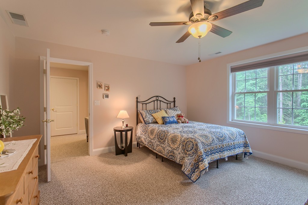 264 Westford Road Tyngsborough, MA 01879 - Photo 22 of 27 a bedroom with a bed dresser and a window